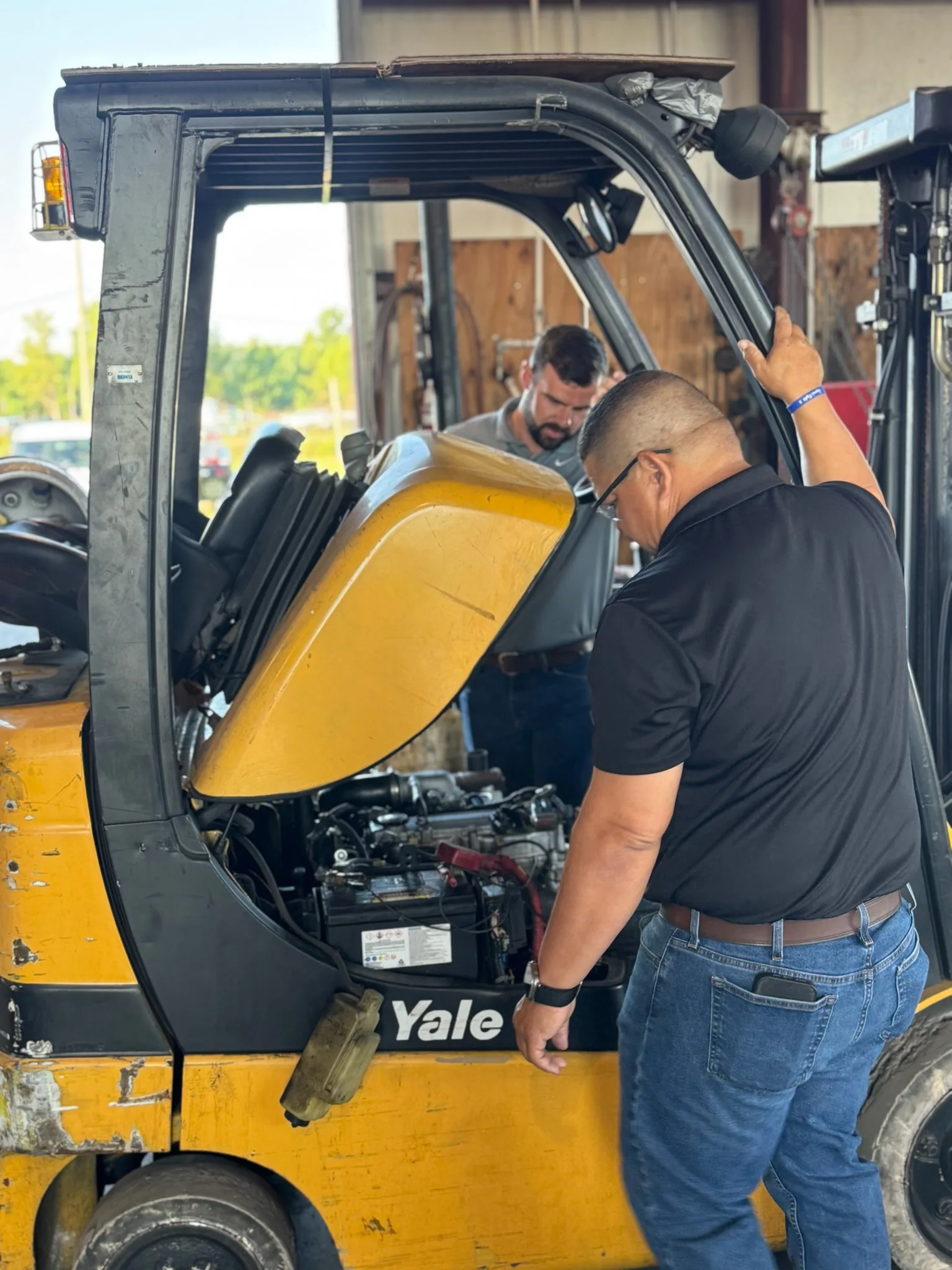 Bolton Equipment technician performing a Yale forklift repair in the Thibodaux shop