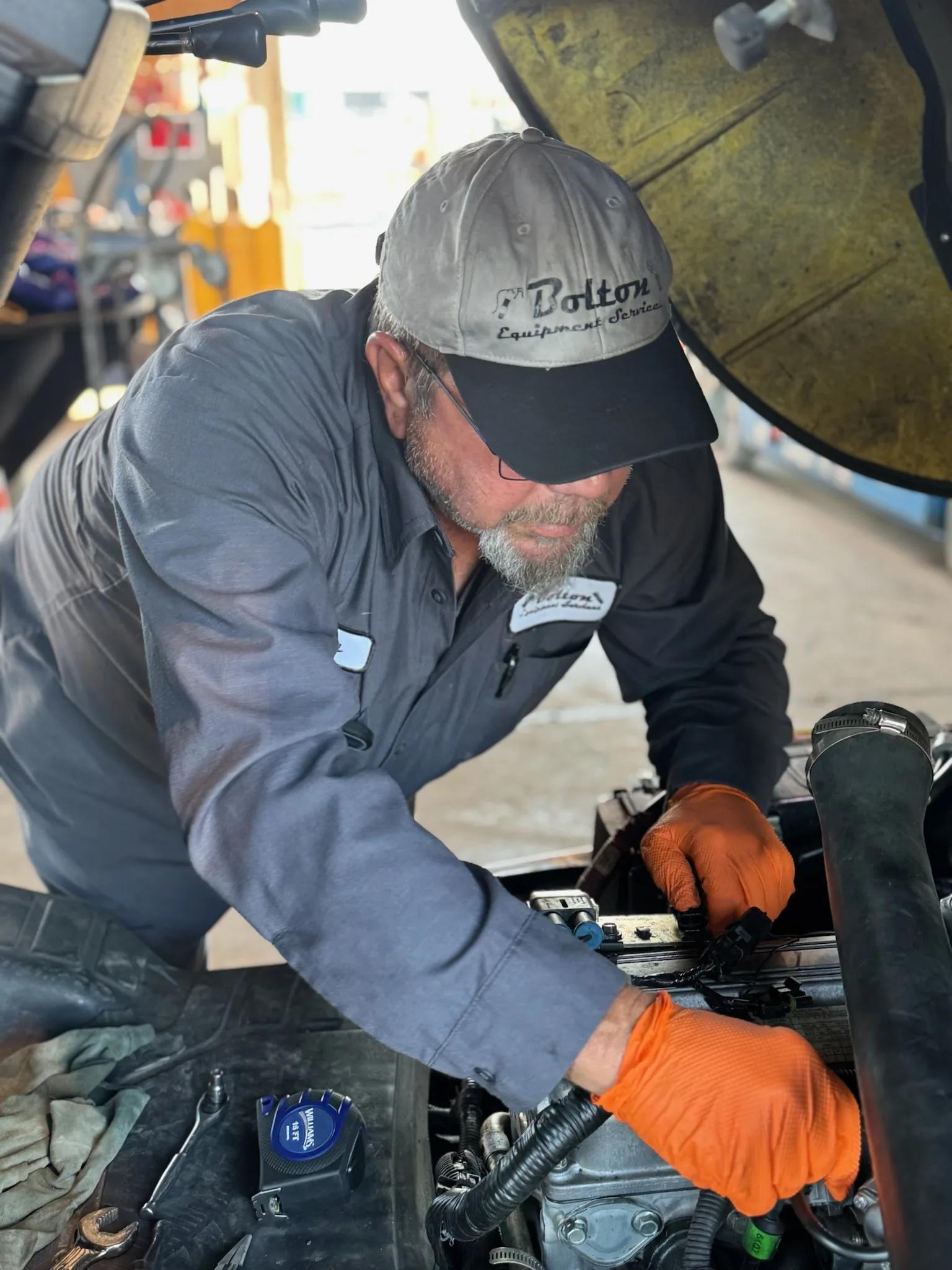 Close-up of a Yale industrial forklift engine compartment during a hydraulic service call